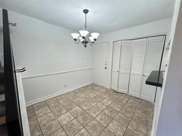 a view of an empty room with a mirror