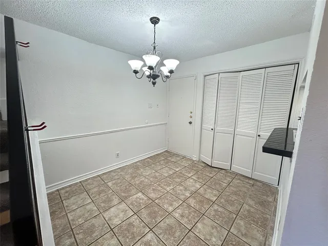 a view of an empty room with a mirror