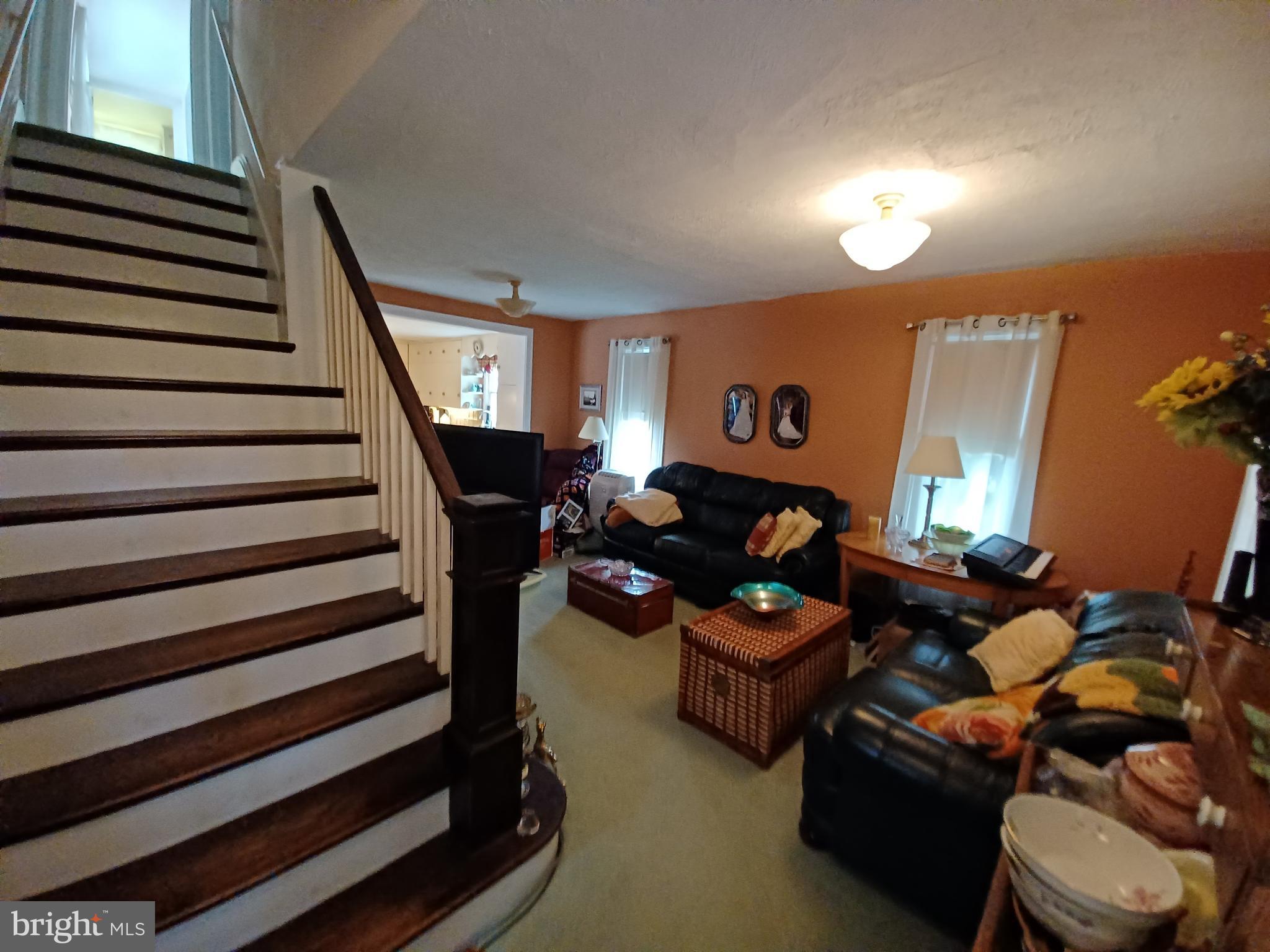 174 Niantic Road Barto, PA 19504 - Photo 11 of 35 Living room feels larger because of staircase
