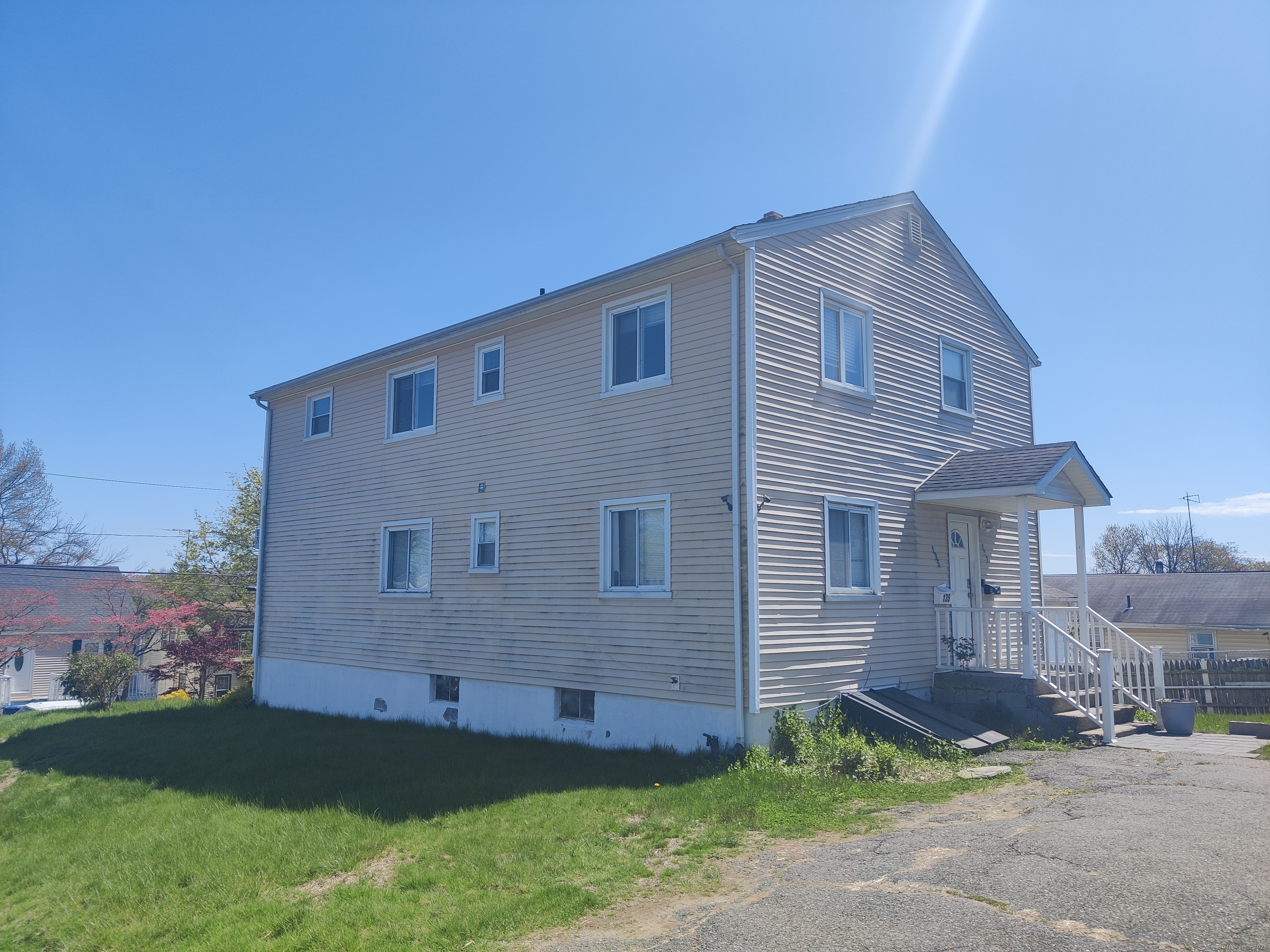 135 Hillcrest Road Bridgeport, CT 06606 - Photo 1 of 1 a front view of a house with a garden