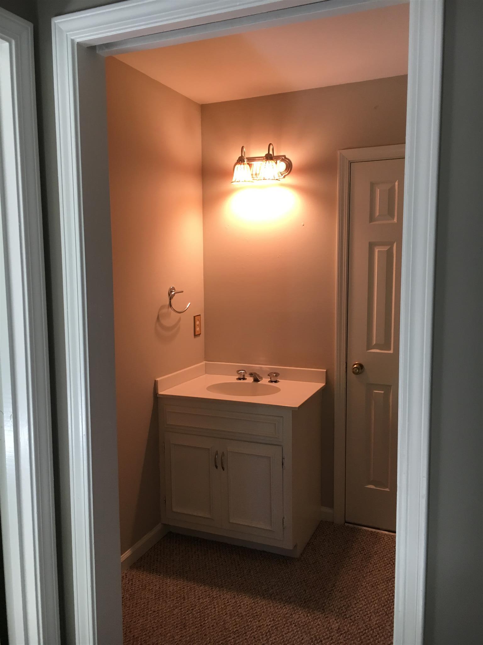 1128 General George Patton Road, Unit 1128 Nashville, TN 37221 - Photo 22 of 26 a view of a bathroom with a sink and mirror