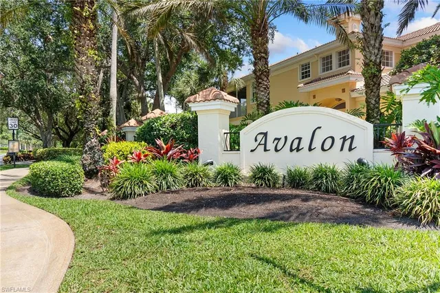 a view of a sign board with a yard