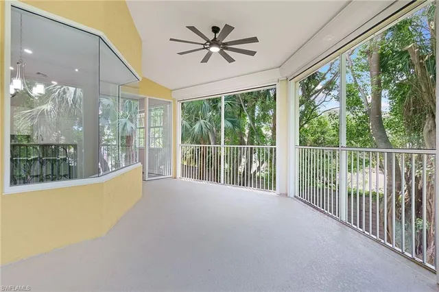 a view of a living room and balcony