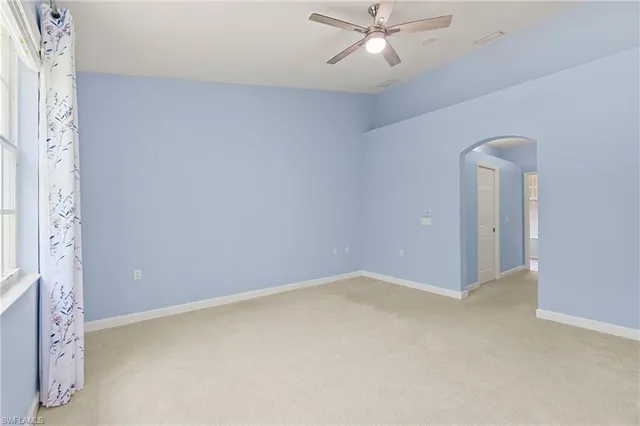 a spacious bathroom with a shower sink and mirror