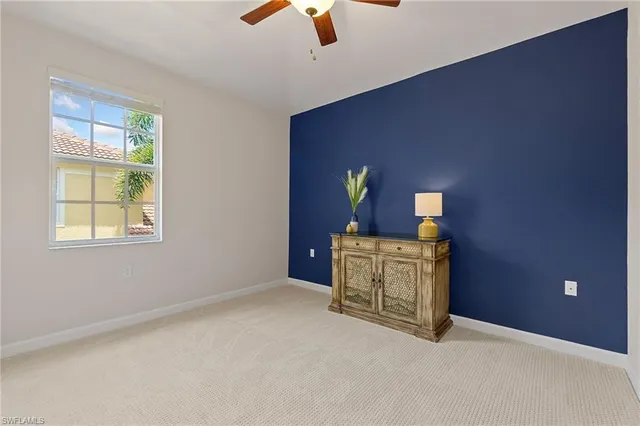 a bathroom with a toilet a sink and a mirror