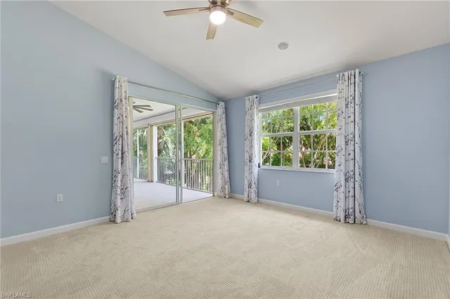 a view of an empty room with windows