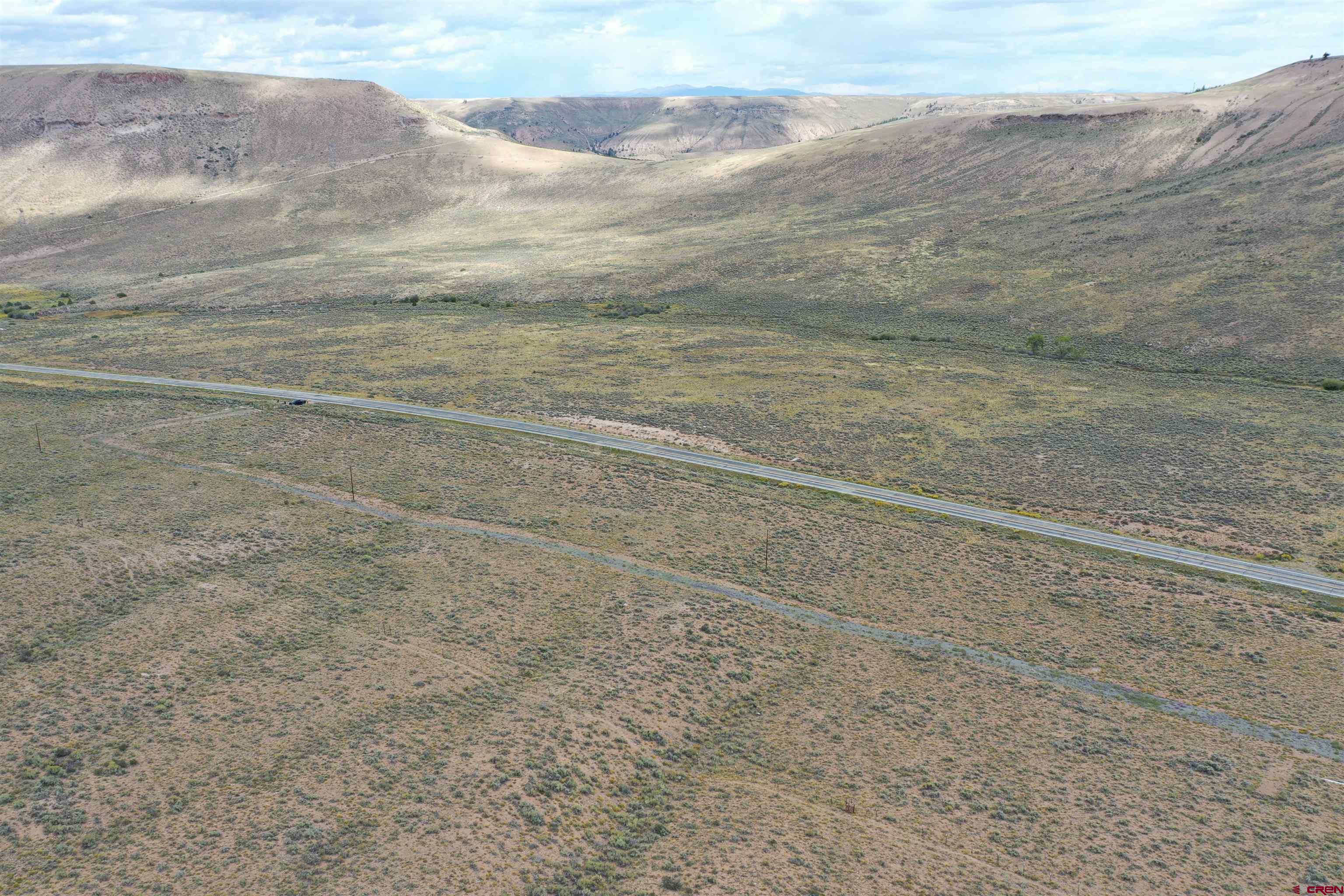 240 Spring Drive Gunnison, CO 81230 - Photo 10 of 15 a view of a dry yard with wooden floor