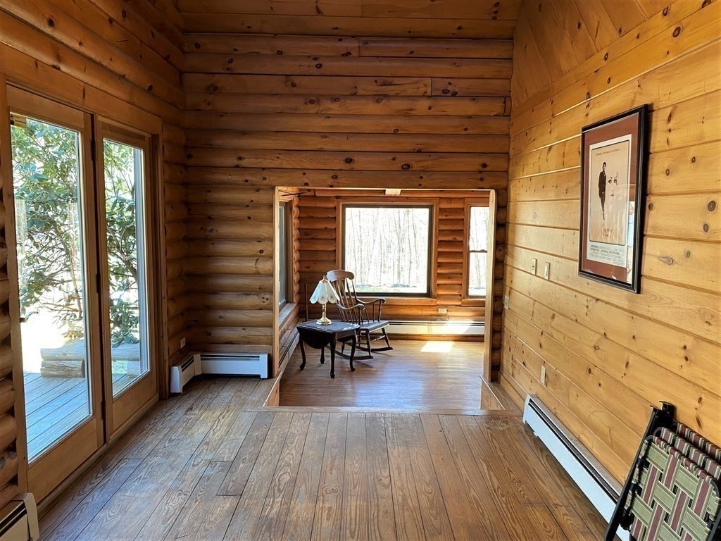 2089 Greenwich Road Hardwick, MA 01082 - Photo 19 of 38 a hallway with wooden floor and furniture