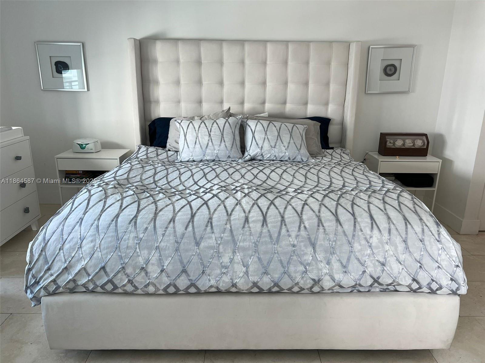 90 Southwest 3rd Street, Unit 2103 Miami, FL 33130 - Photo 12 of 31 a large bed sitting in a bedroom next to a window