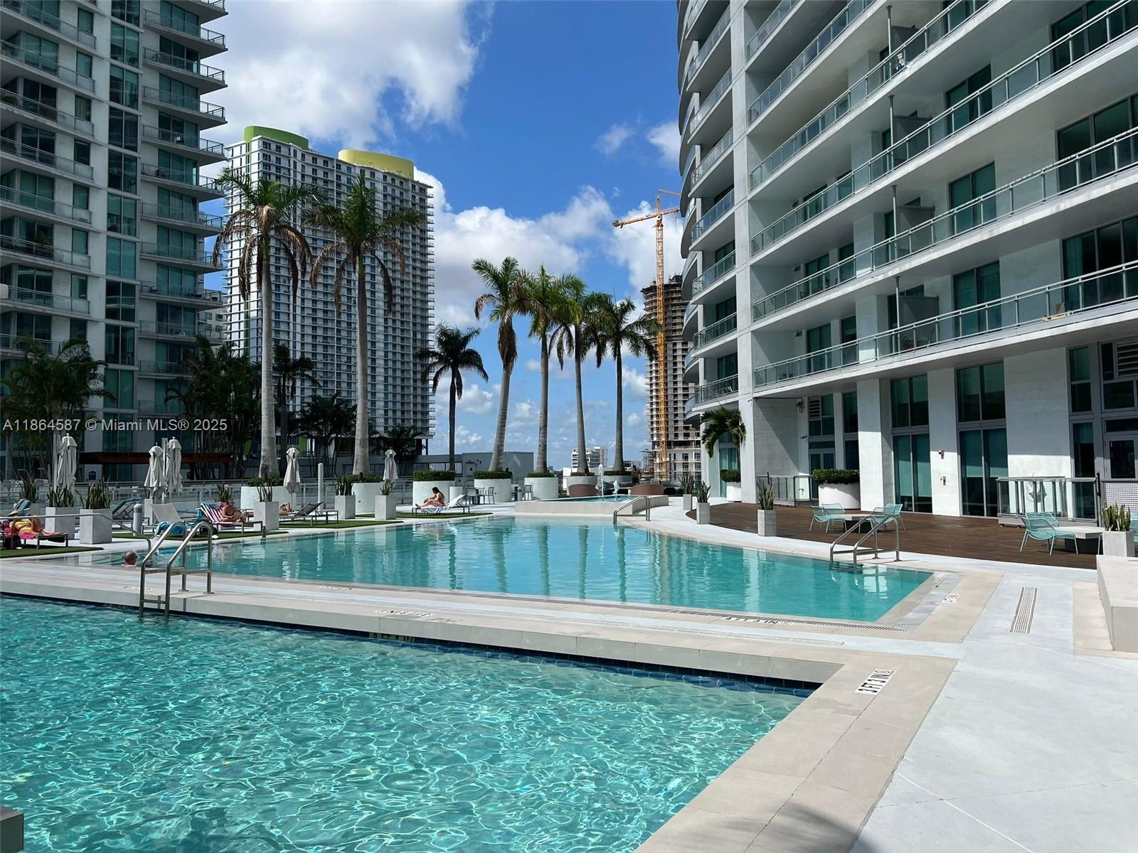 90 Southwest 3rd Street, Unit 2103 Miami, FL 33130 - Photo 27 of 31 a view of a building with a yard