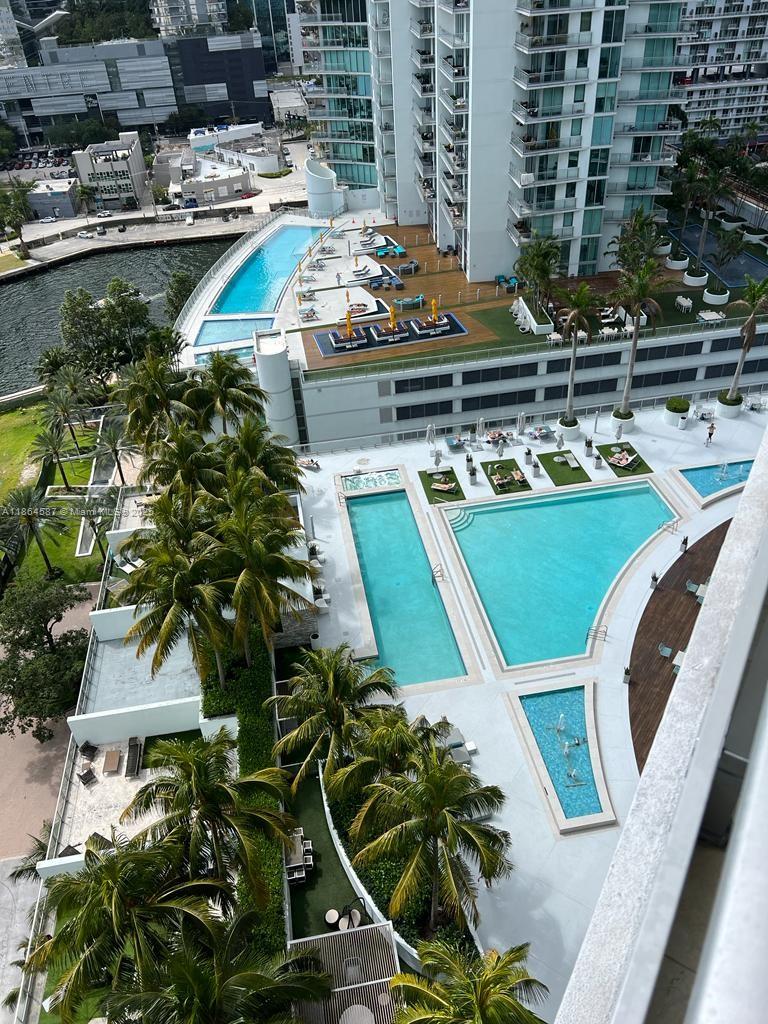 90 Southwest 3rd Street, Unit 2103 Miami, FL 33130 - Photo 28 of 31 a picture of a table and chairs