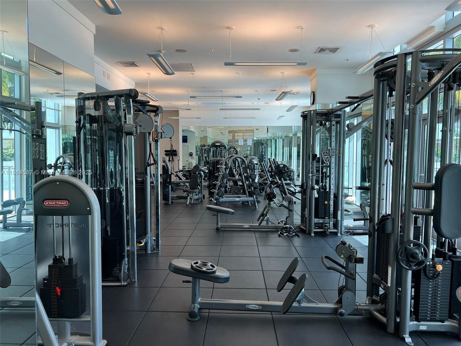90 Southwest 3rd Street, Unit 2103 Miami, FL 33130 - Photo 29 of 31 a gym room with lots of gym equipment