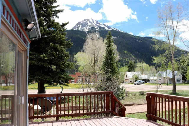a view of a street with a tree