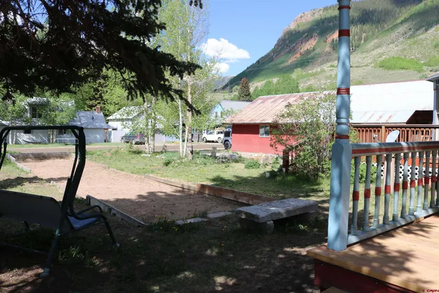a view of backyard with sitting area