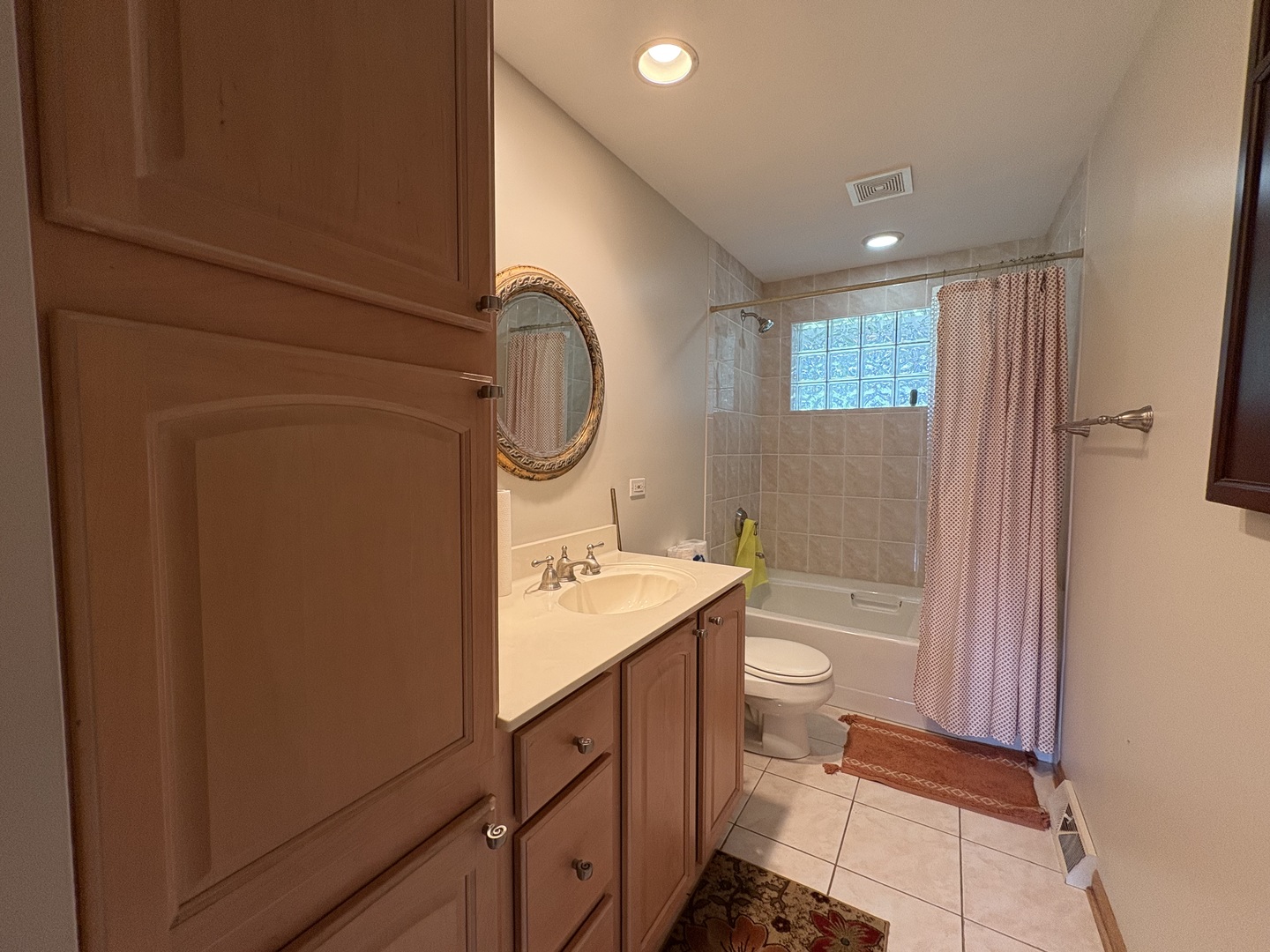 260 North St Marys Road Libertyville, IL 60048 - Photo 4 of 15 a bathroom with a toilet a sink and mirror