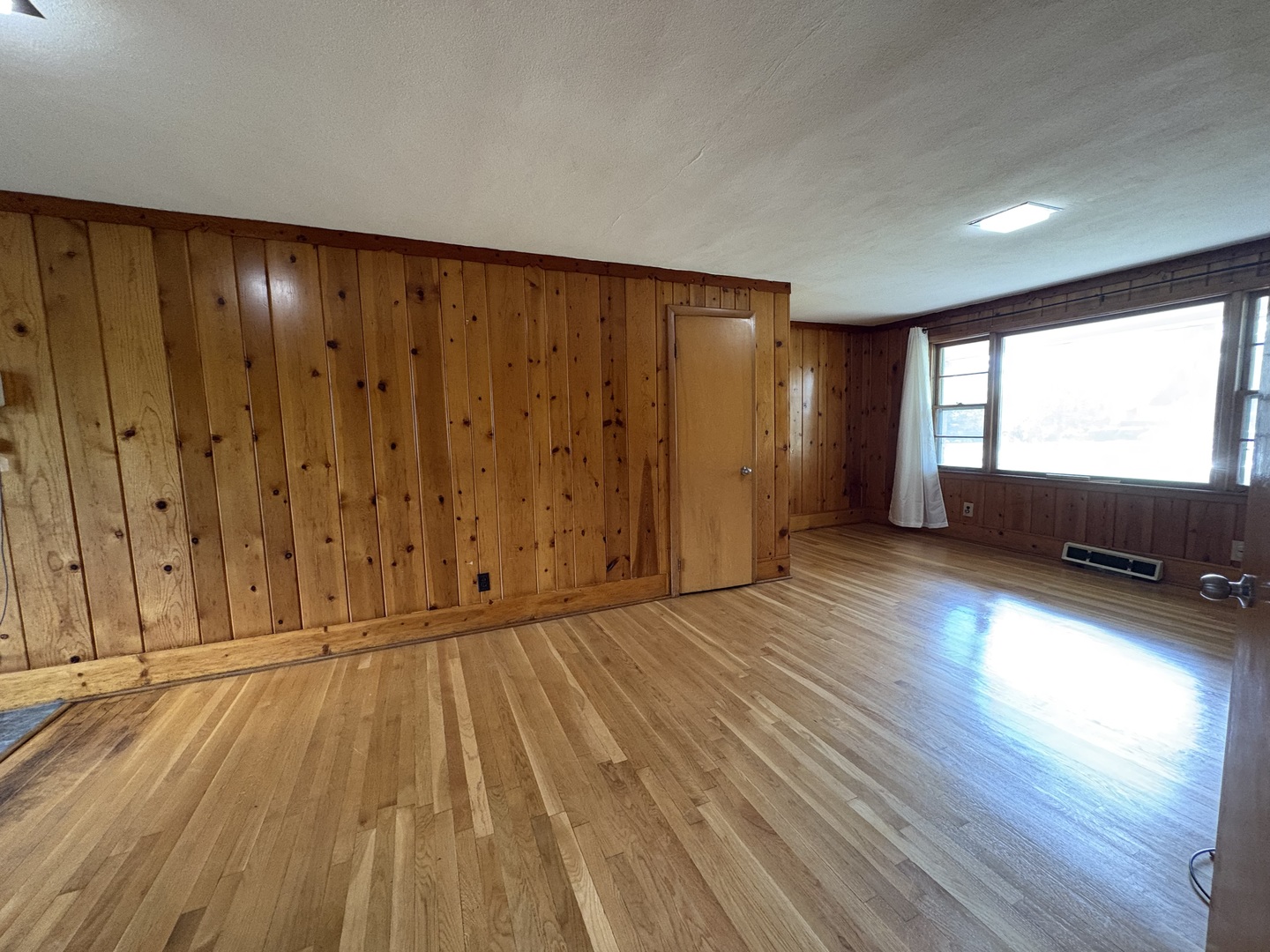 260 North St Marys Road Libertyville, IL 60048 - Photo 10 of 15 a view of an empty room with wooden floor and a window