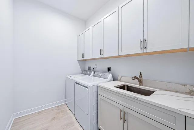 a view of a sink and cabinets