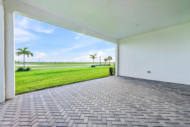 a view of a big yard with a house