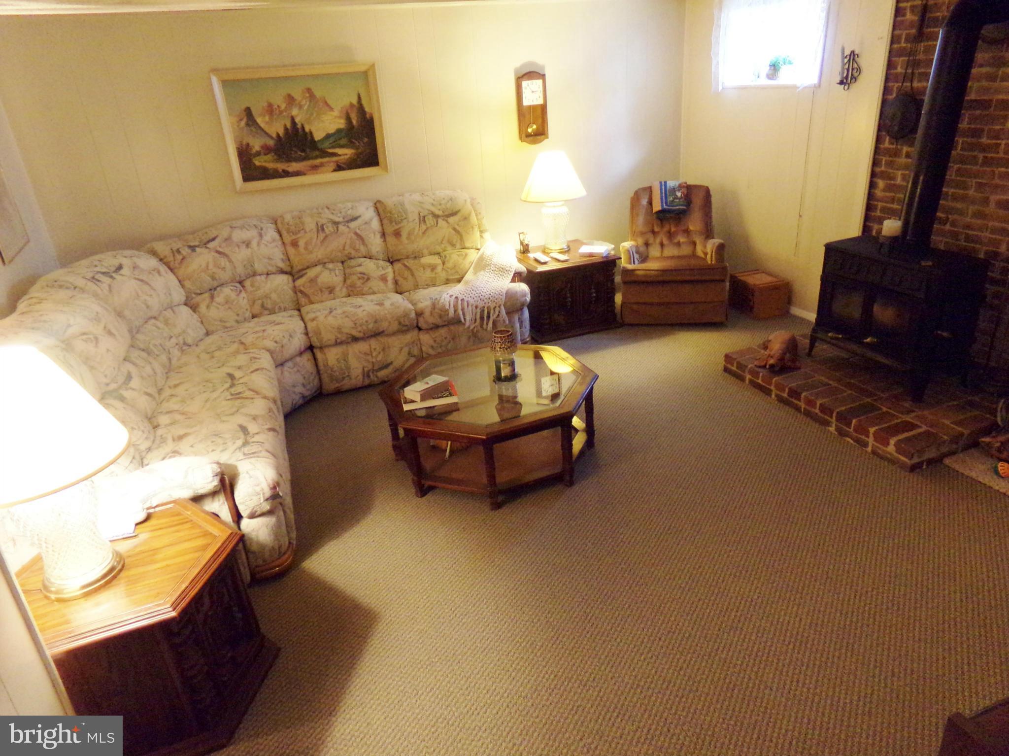 8113 Phirne Road East Glen Burnie, MD 21061 - Photo 15 of 27 a living room with furniture and a couch
