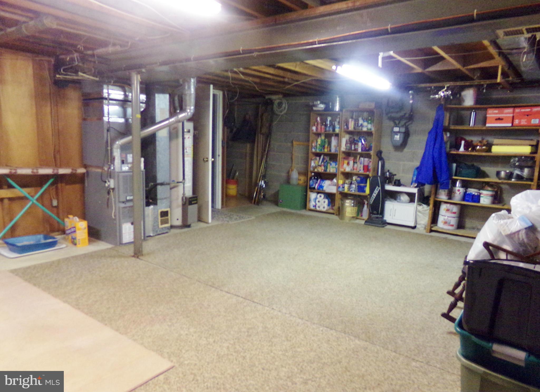 8113 Phirne Road East Glen Burnie, MD 21061 - Photo 16 of 27 a view of a storage room with a lot of stuff