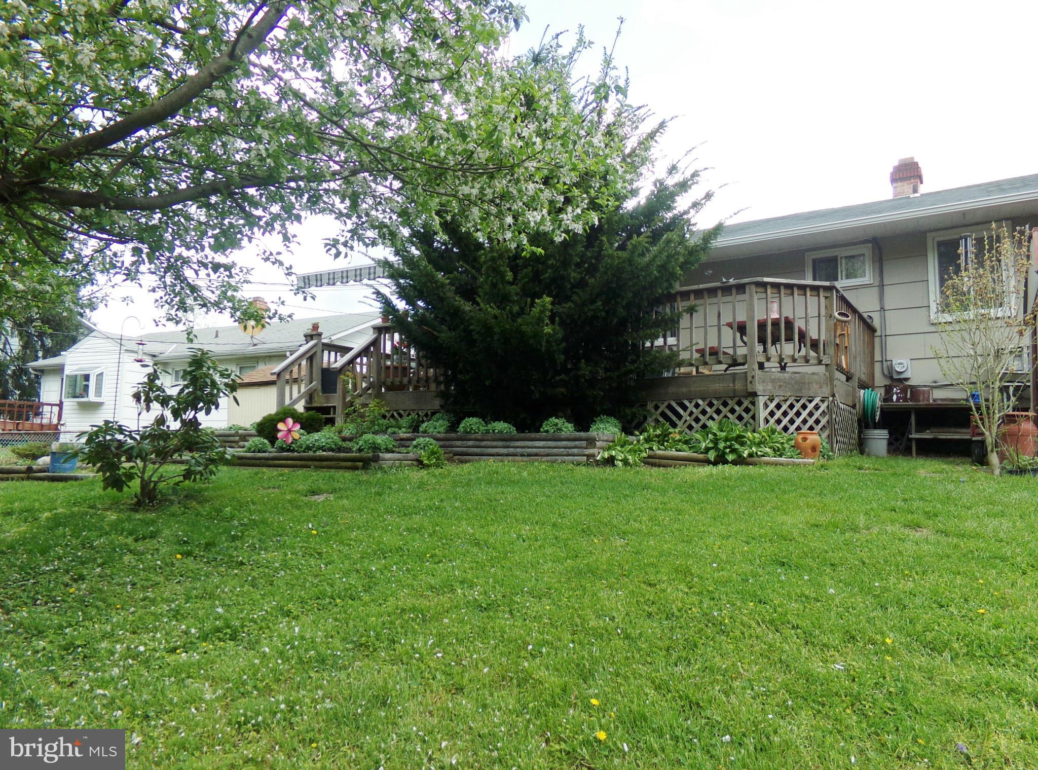 8113 Phirne Road East Glen Burnie, MD 21061 - Photo 19 of 27 a front view of a house with garden