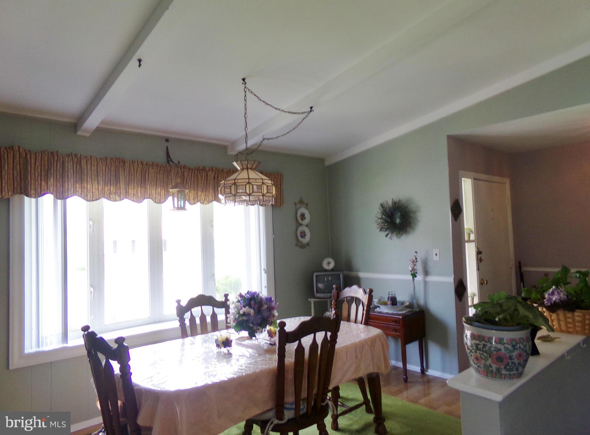 8113 Phirne Road East Glen Burnie, MD 21061 - Photo 22 of 27 a view of a dining room with furniture window and outside view