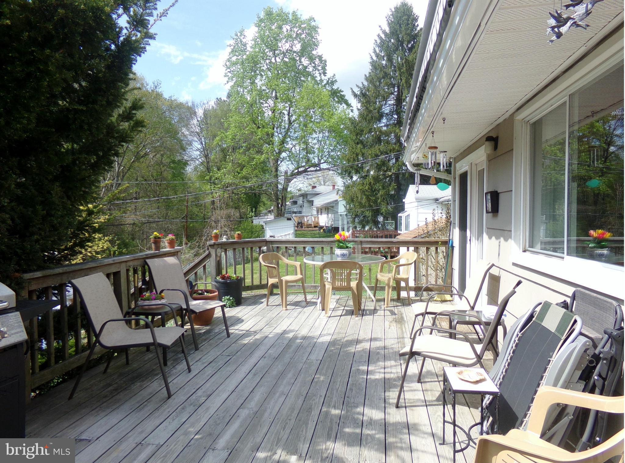 8113 Phirne Road East Glen Burnie, MD 21061 - Photo 26 of 27 a view of a balcony with chairs and wooden floor