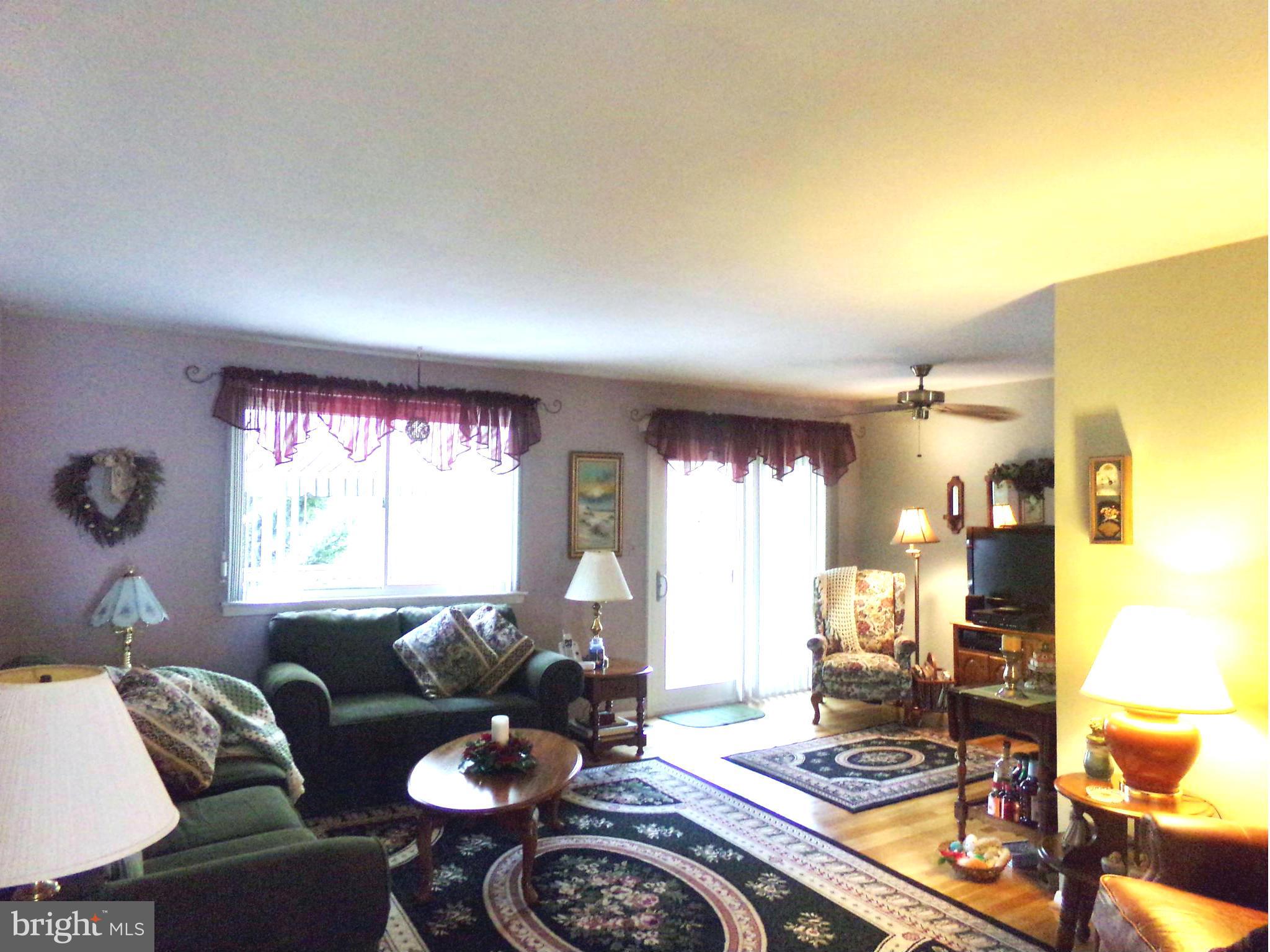 8113 Phirne Road East Glen Burnie, MD 21061 - Photo 6 of 27 a living room with furniture and a large window