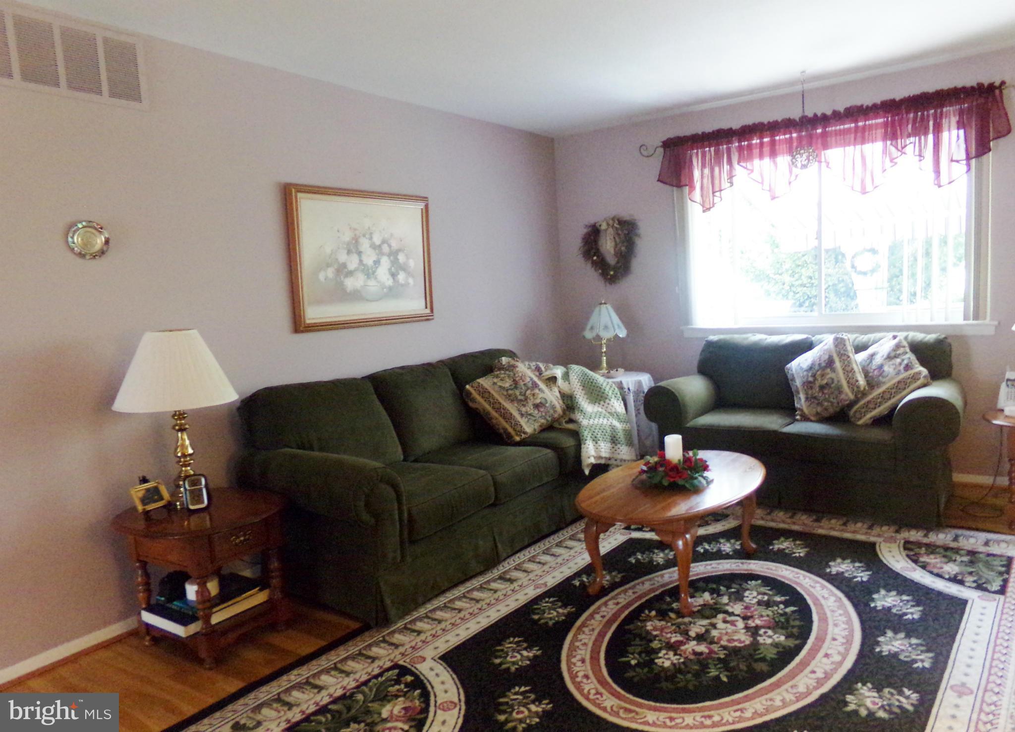 8113 Phirne Road East Glen Burnie, MD 21061 - Photo 7 of 27 a living room with furniture and a window