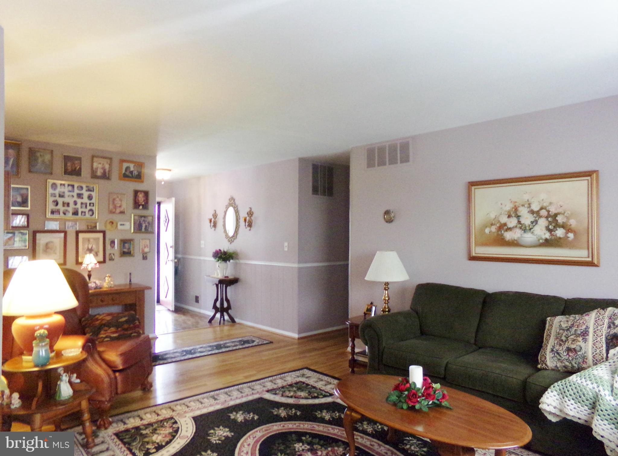 8113 Phirne Road East Glen Burnie, MD 21061 - Photo 9 of 27 a living room with furniture and wooden floor