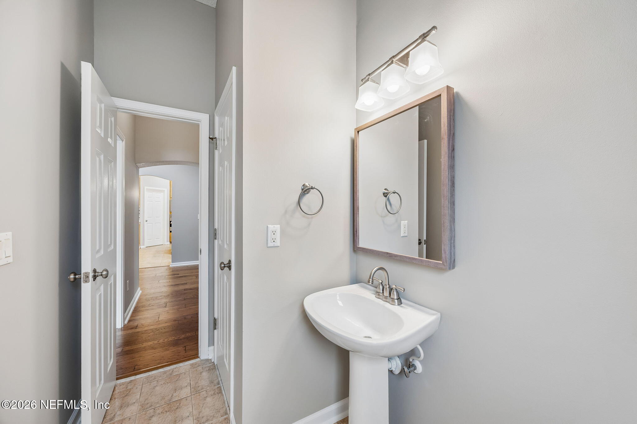 213 Springwood Lane St. Johns, FL 32259 - Photo 17 of 78 a bathroom with a sink mirror and shower