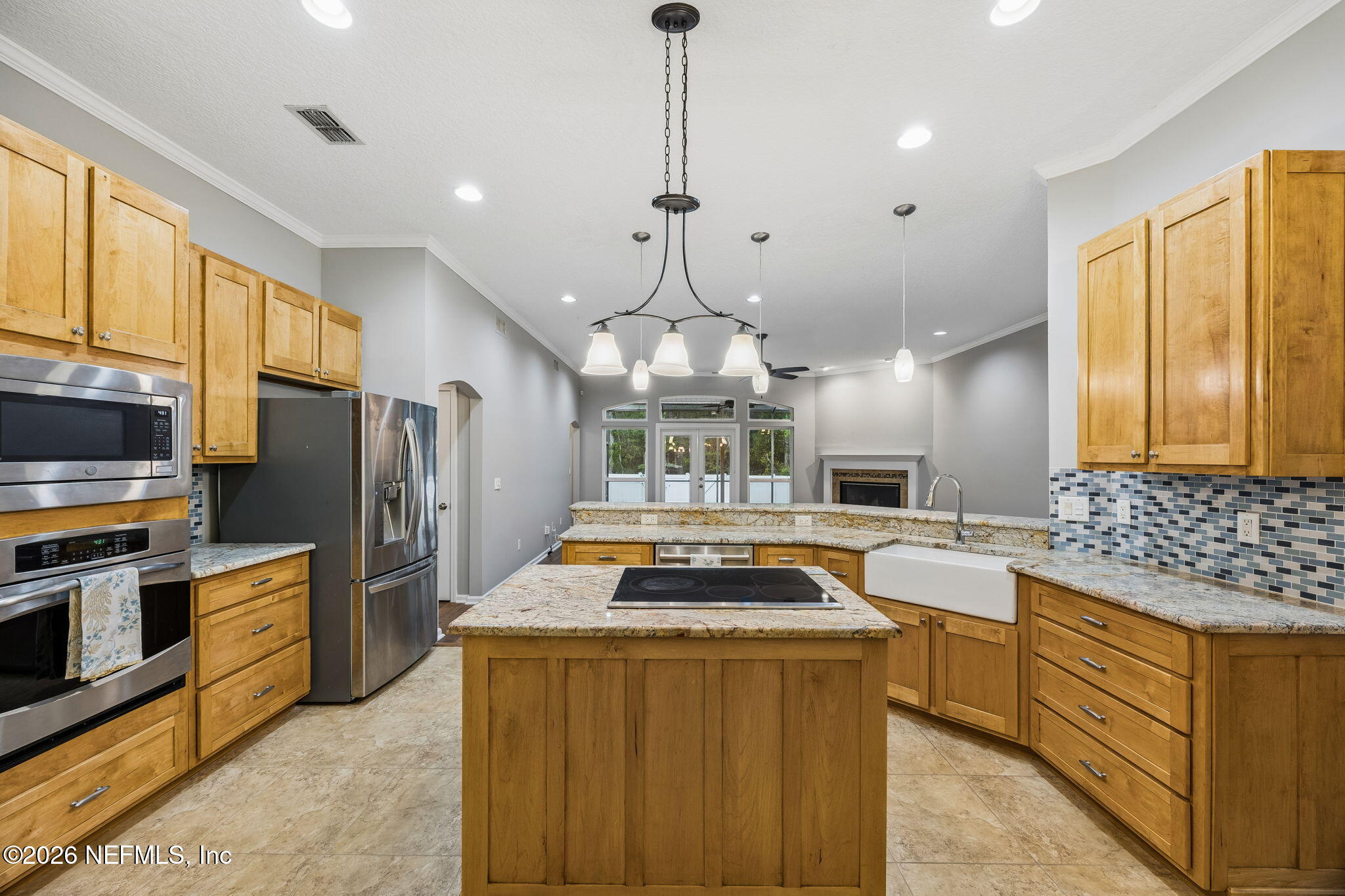 213 Springwood Lane St. Johns, FL 32259 - Photo 18 of 78 a kitchen with stainless steel appliances a sink stove and refrigerator