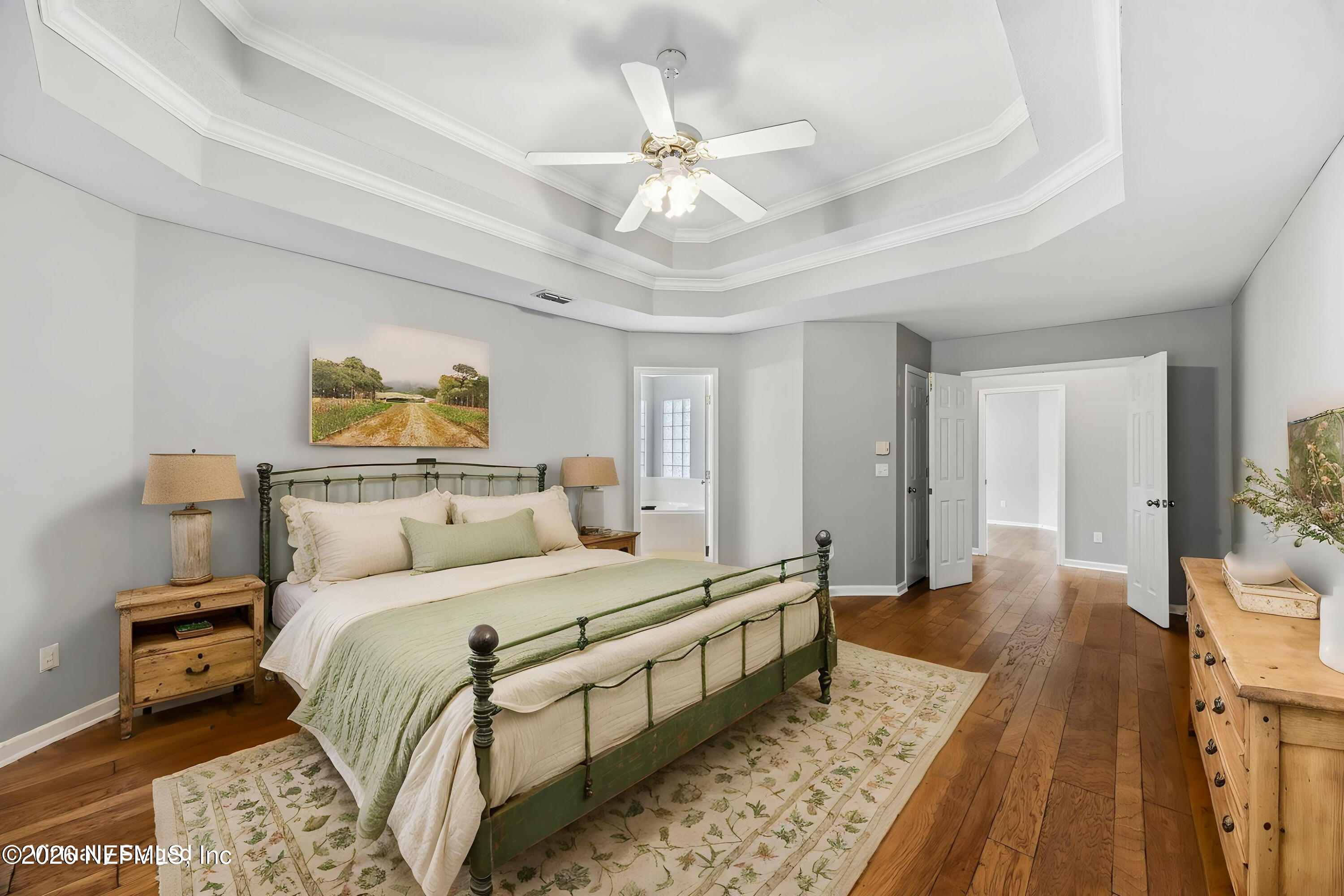 213 Springwood Lane St. Johns, FL 32259 - Photo 31 of 78 a bedroom with a bed and a chandelier