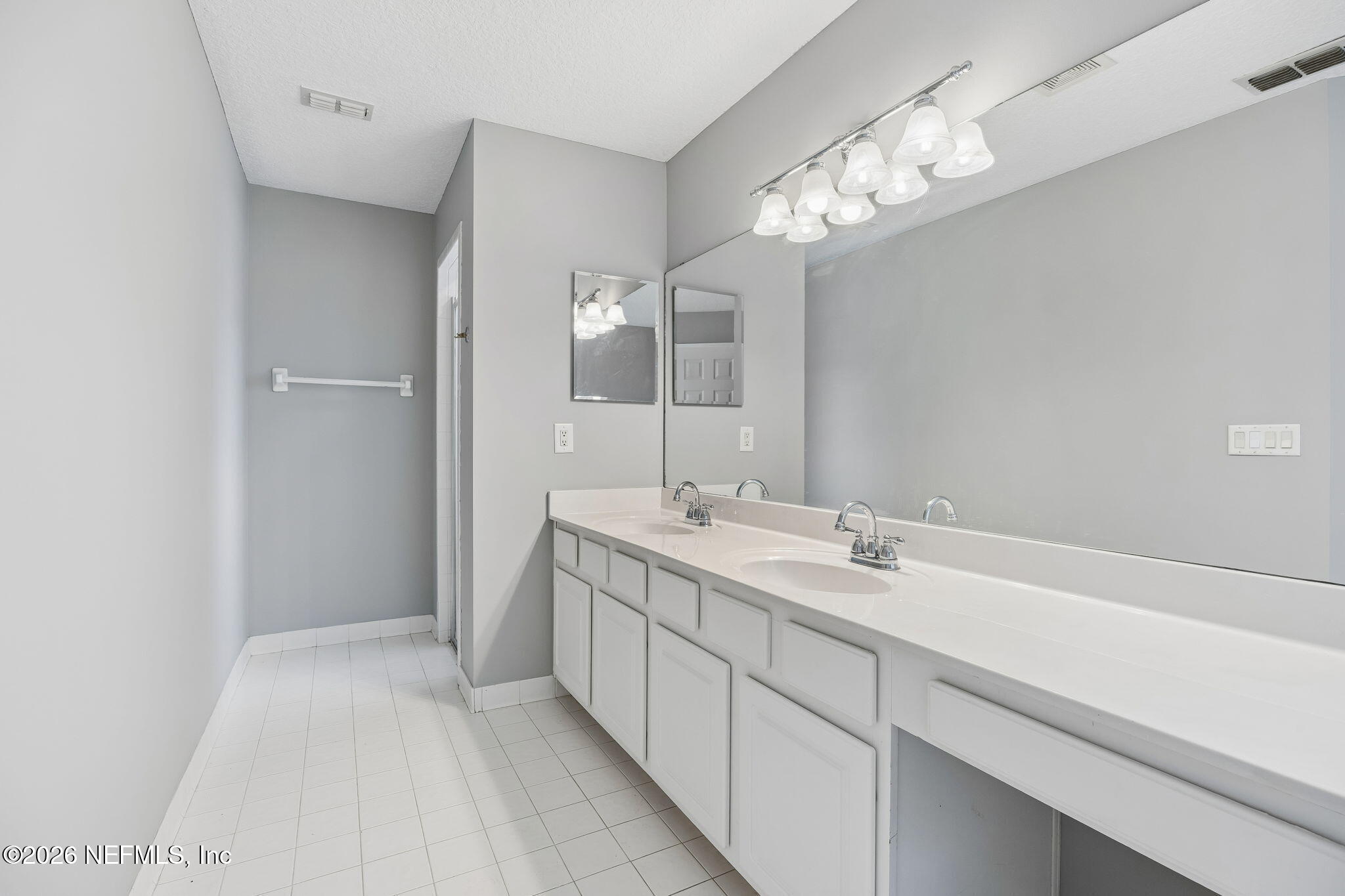 213 Springwood Lane St. Johns, FL 32259 - Photo 34 of 78 a bathroom with a double vanity sink and a mirror