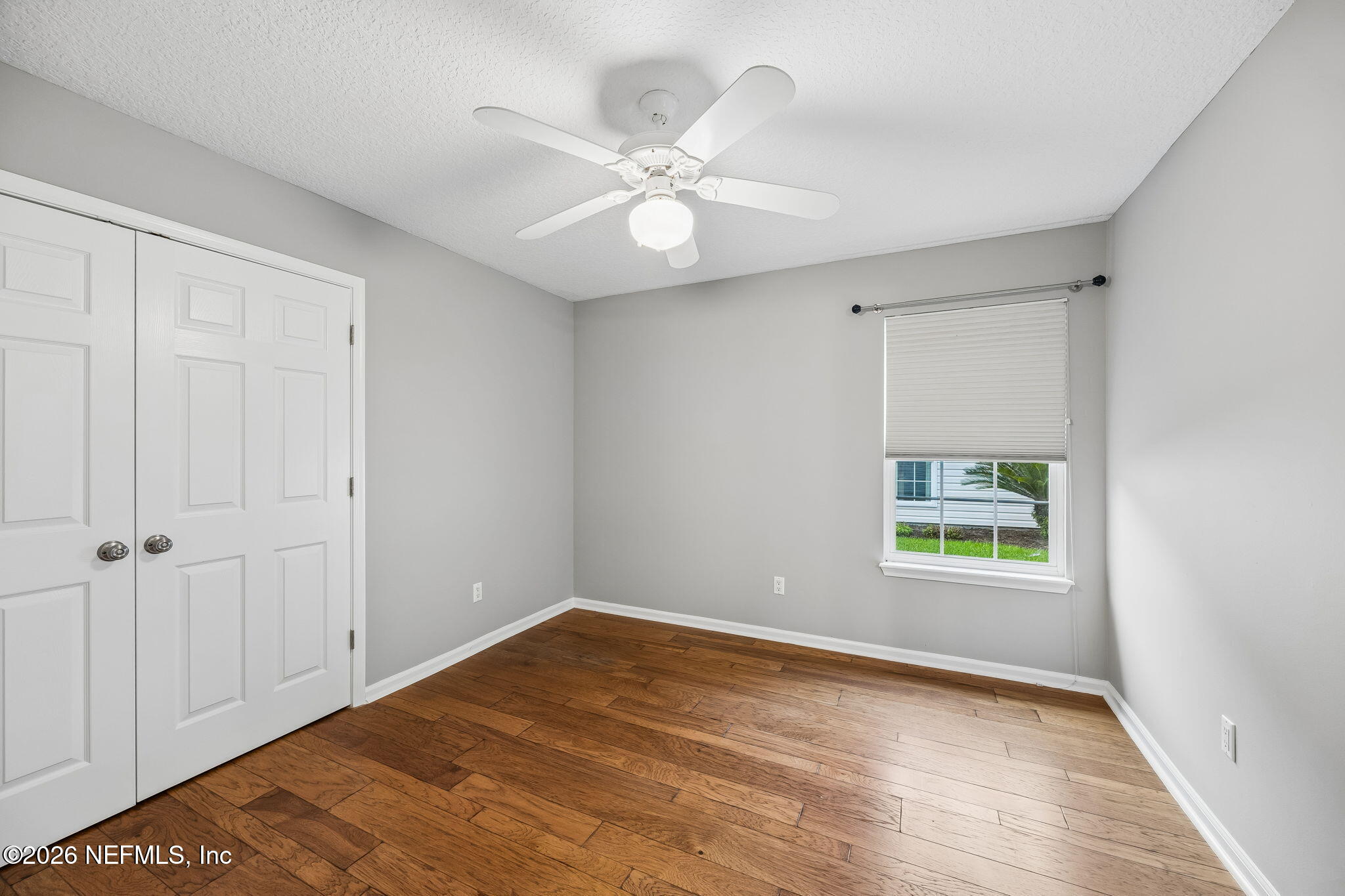 213 Springwood Lane St. Johns, FL 32259 - Photo 43 of 78 an empty room with a window and ceiling fan