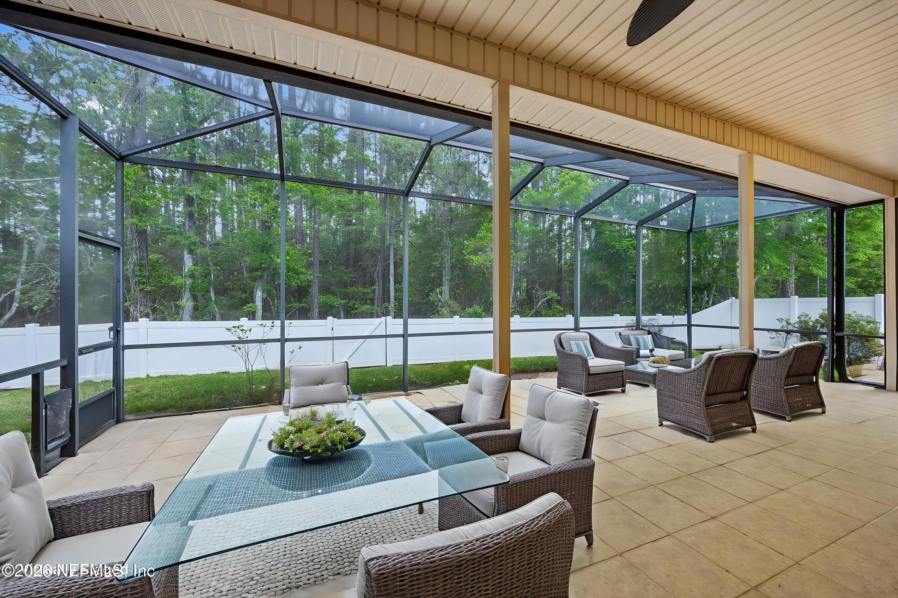 213 Springwood Lane St. Johns, FL 32259 - Photo 49 of 78 a view of a patio with couches chairs dining table and chairs