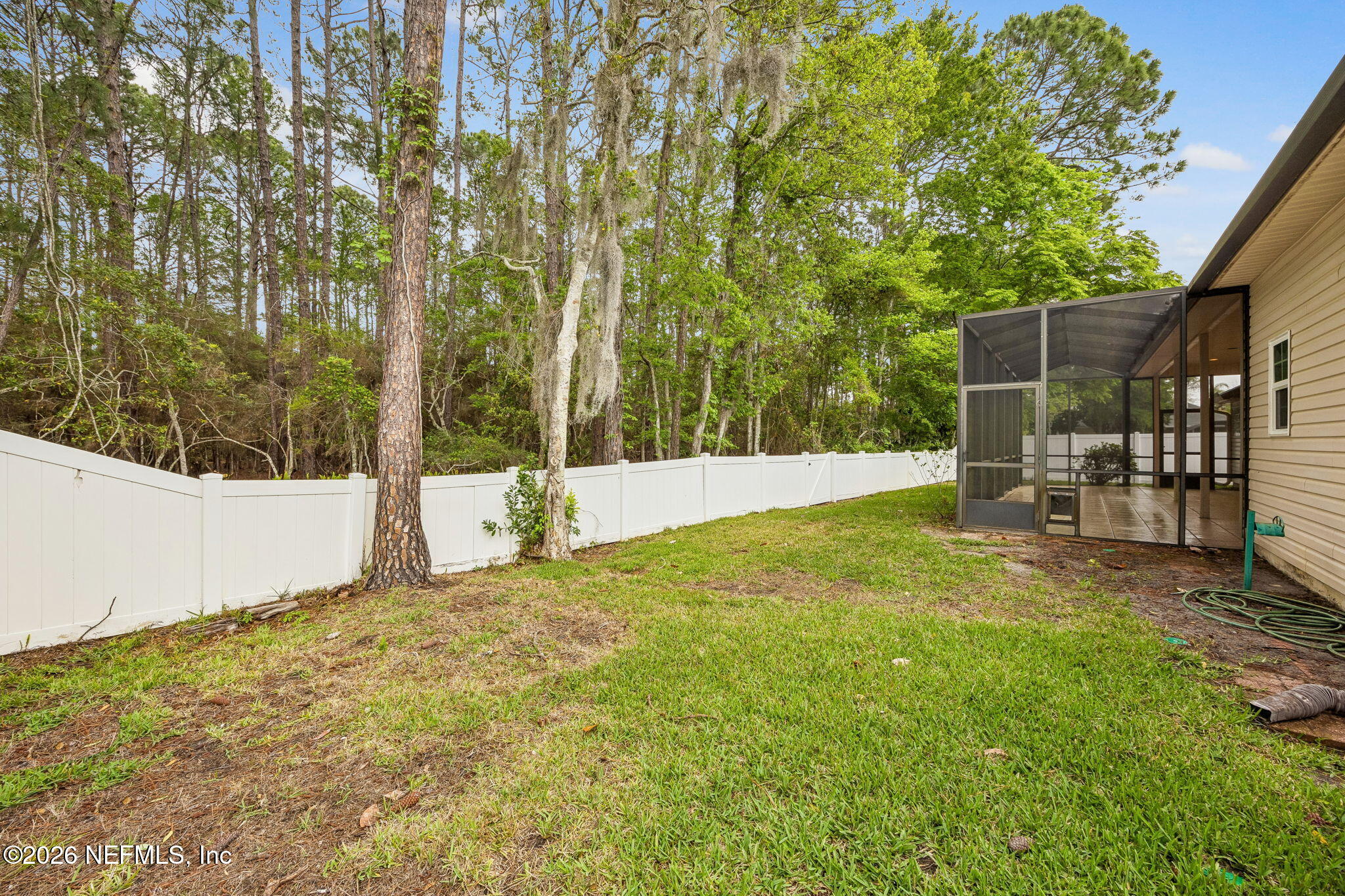 213 Springwood Lane St. Johns, FL 32259 - Photo 50 of 78 a view of backyard with table and chairs