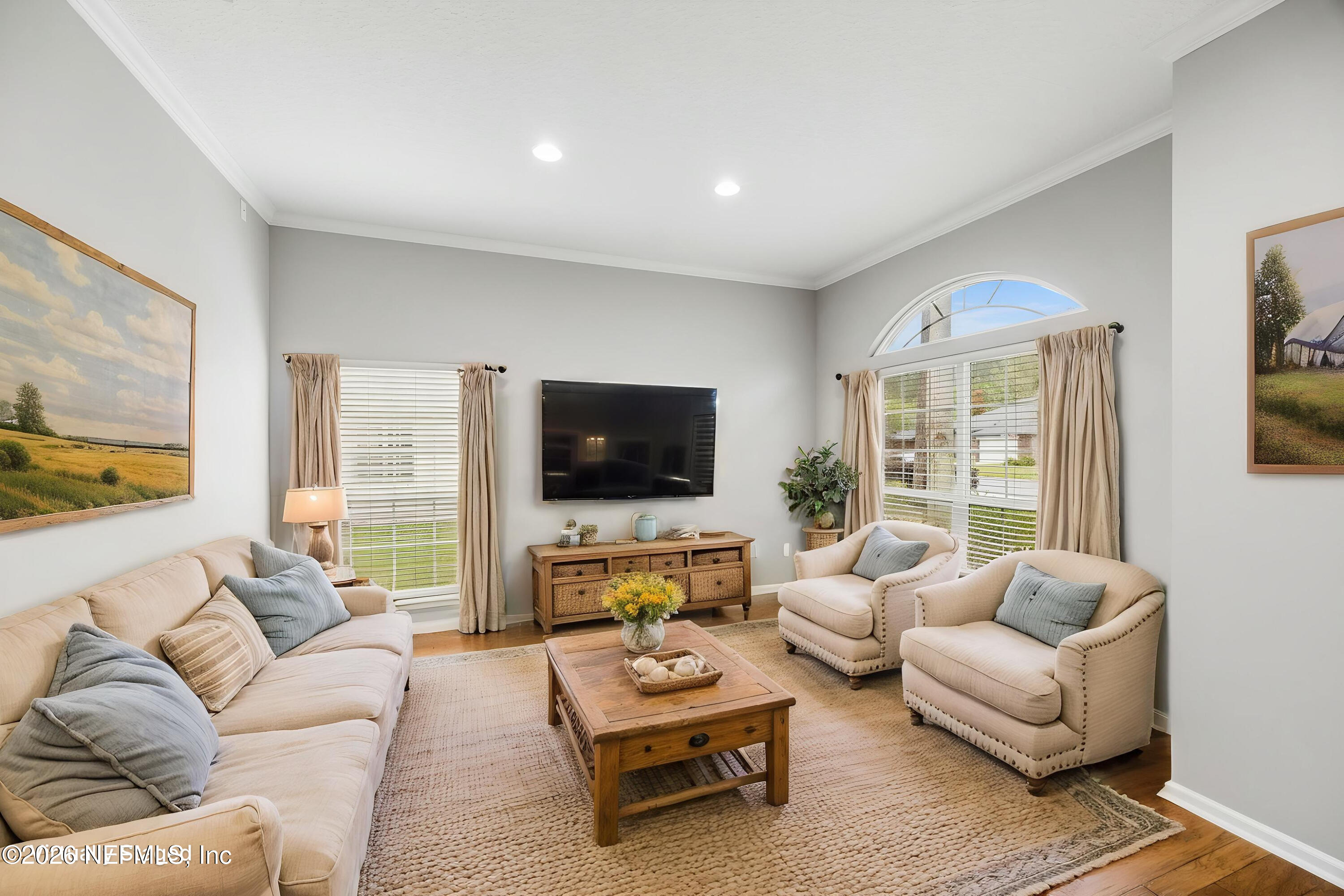 213 Springwood Lane St. Johns, FL 32259 - Photo 10 of 78 a living room with furniture flat screen tv and a large window