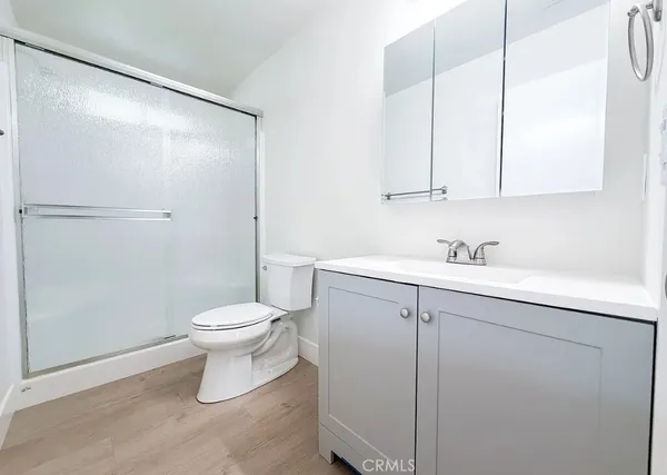 a bathroom with a sink toilet and vanity