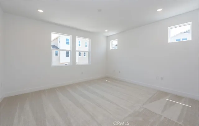 a spacious bathroom with a shower sink and mirror