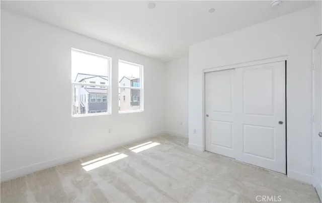 a spacious bathroom with a double vanity sink and mirror