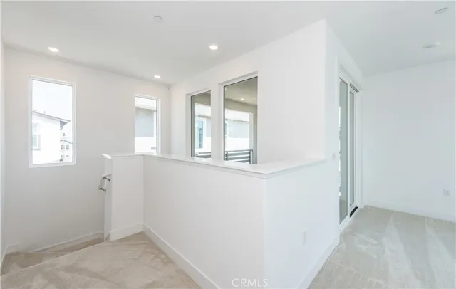 a view of storage and utility room with window