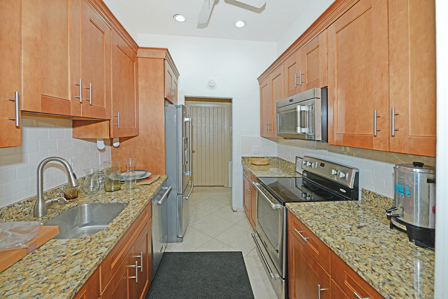 21755 Arriba Real, Unit 29E Boca Raton, FL 33433 - Photo 32 of 33 Clubhouse Kitchen