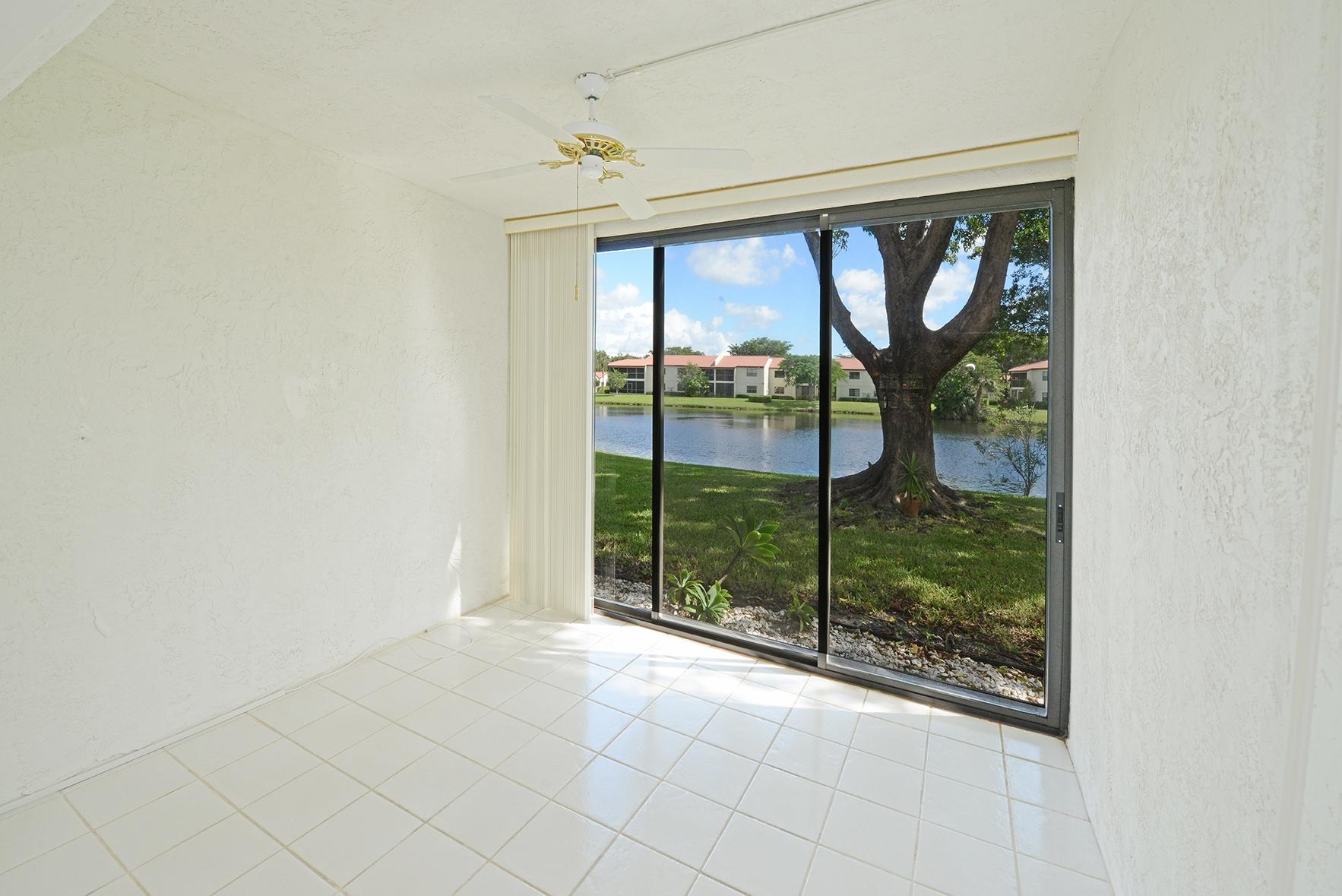 21755 Arriba Real, Unit 29E Boca Raton, FL 33433 - Photo 7 of 33 Enclosed Patio with Lake View