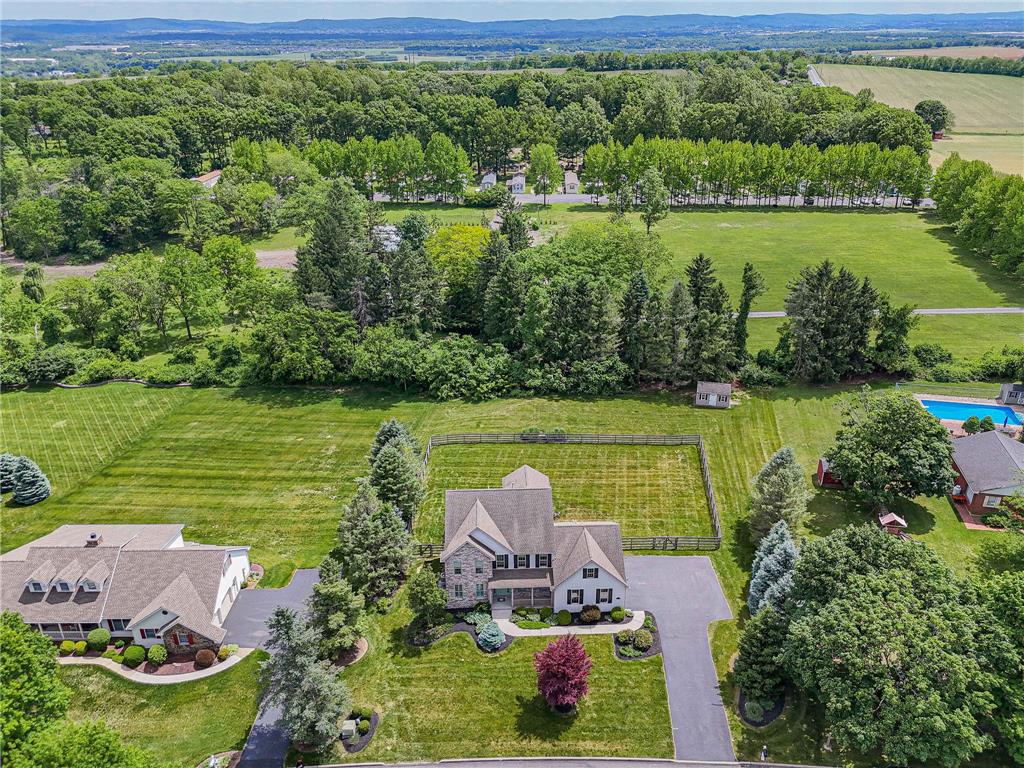 6000 Pond View Terrace Bath, PA 18014 - Photo 8 of 69 An aerial perspective reveals a private yard, lush green landscaping, and expansive acreage.