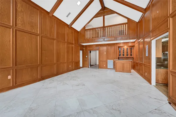 a bathroom with a granite countertop sink and a window