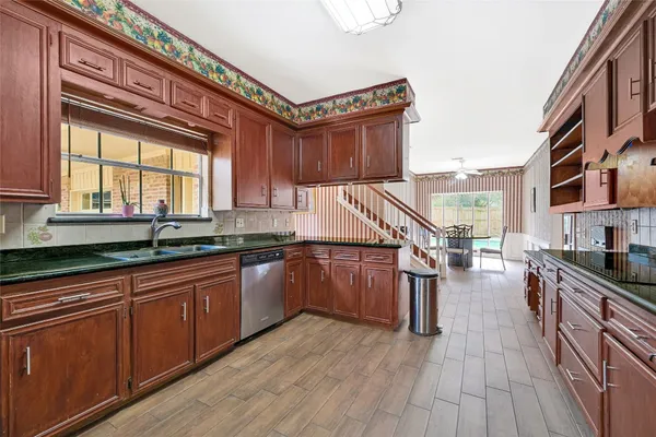 a bathroom with sink a mirror and a vanity