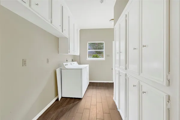 a bathroom with a sink and a mirror with toilet