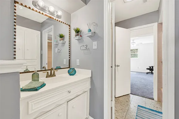 a bathroom with a glass shower door