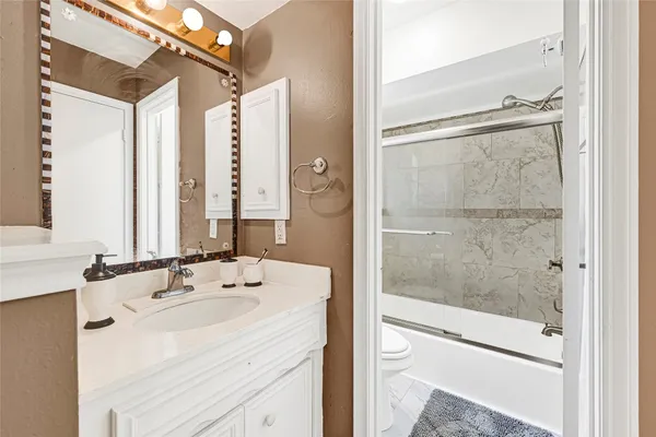 a bathroom with a shower and a toilet